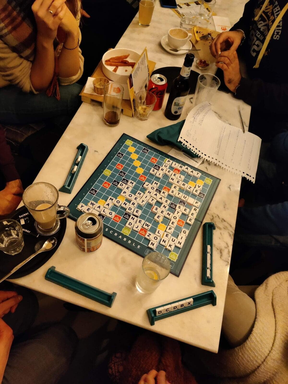 A game of Scrabble with drinks at the bar